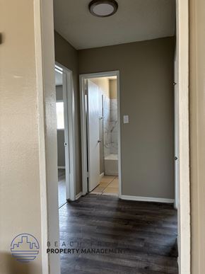 Anaheim apartment for rent - A hallway with a door at the end.